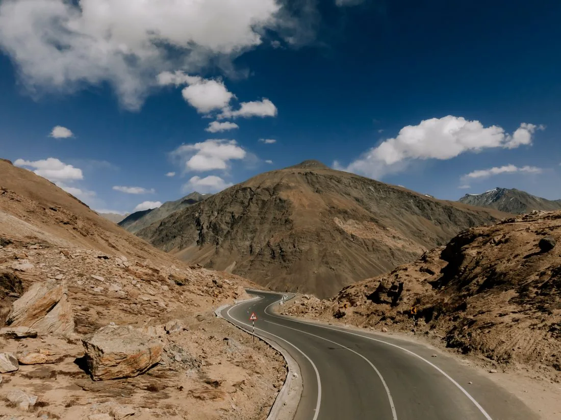 Barren high-altitude Spiti Valley landscape with a monastery on a hill